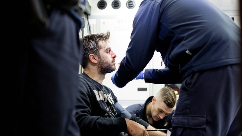 Fabio Pederlynn receives medical attention in Temple Bar. Photograph: Tom Honan