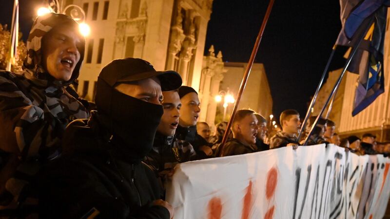 A few hundred protesters rallied in central Kiev on Tuesday night to denounce the plan, including members of far-right groups. Photograph: Genya Savilov/AFP/Getty Images
