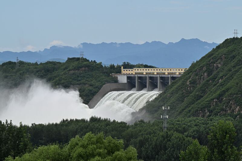 Water is released from the spillway of the Miyun reservoir in Miyun district, on the outskirts of Beijing. Photograph: Adek Berry/AFP via Getty