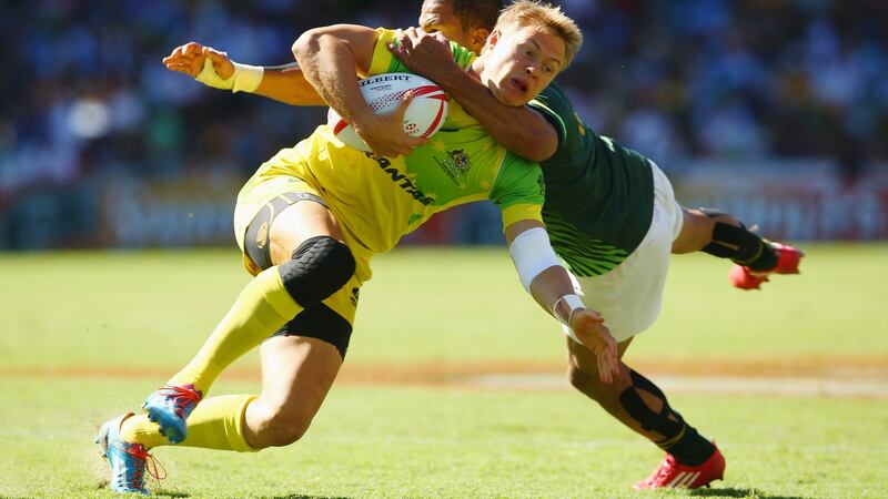 Tom Kingston of Australia is tackled high by Juan de Jongh of South Africa during the 2016 Sydney Sevens cup semi final. Photo: Mark Kolbe/Getty Images