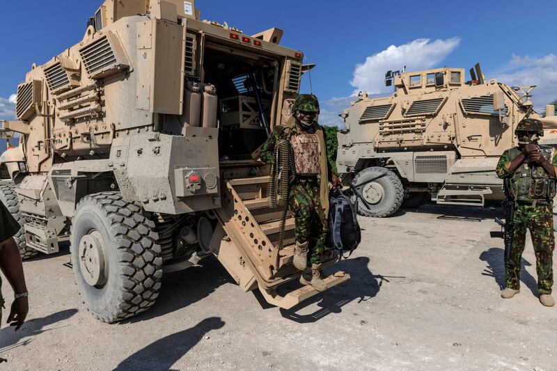 Members of the Kenya Multinational Security Support Mission Force in Haiti arrive at their base after a patrol in Port-au-Prince last September. Photograph: Adriana Zehbrauskas/The New York Times
                      
