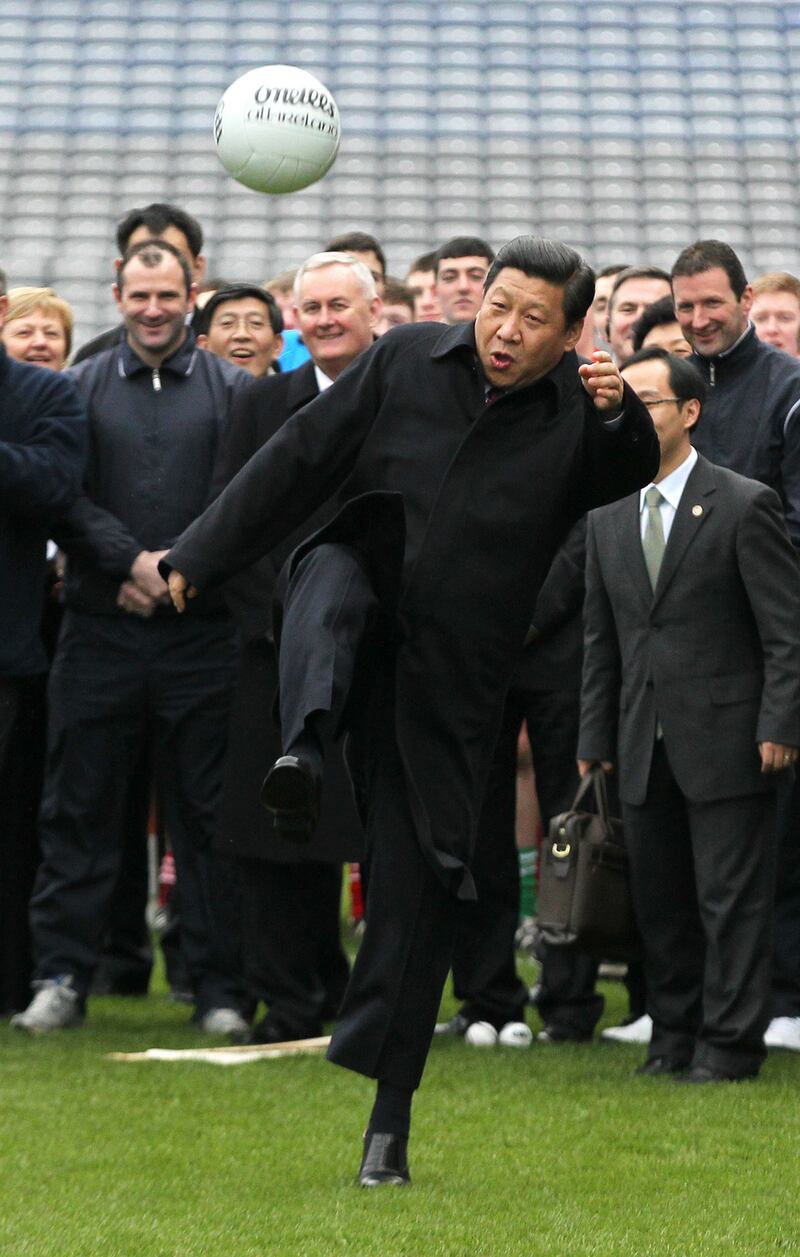 Chinese vice-president Xi Jinping kicks a Gaelic football as he visits Croke Park in Dublin in February 2012. Photograph: Peter Muhly/AFP/Getty