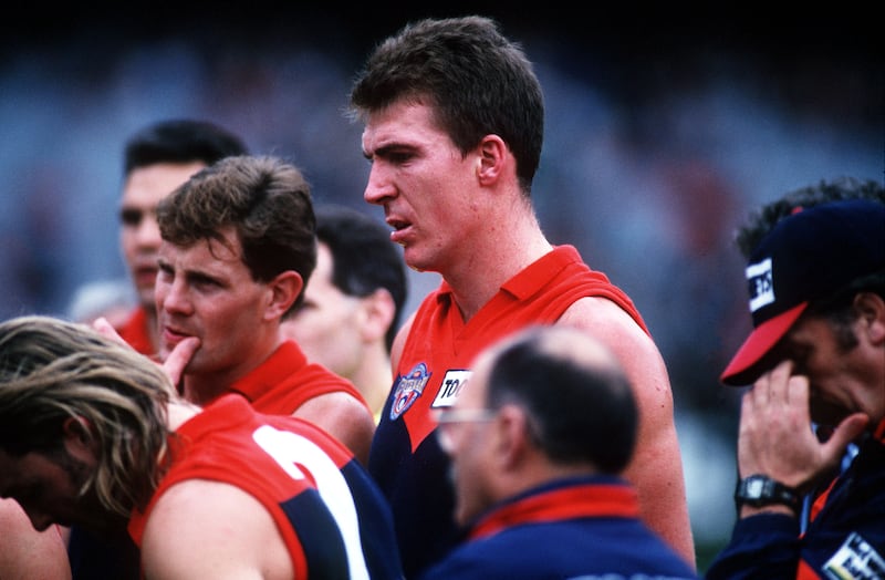 Jim Stynes listens to the coach during his 205th game for Melbourne in May 1996. Photograph: Stuart Milligan/Allsport