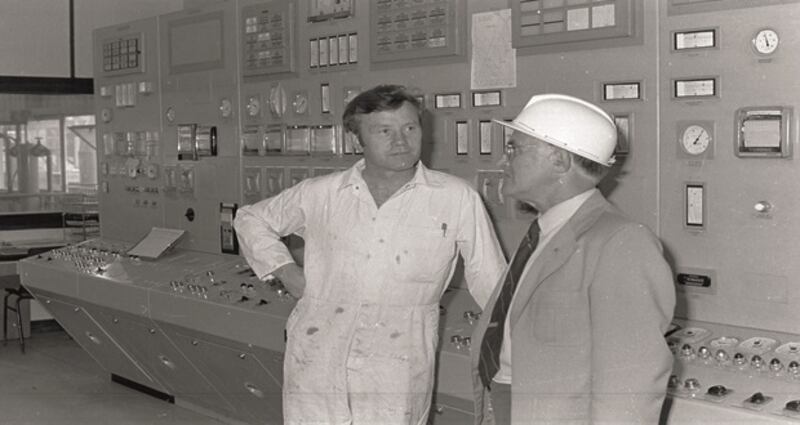 Colleagues having a conversation in the Fermentation Control Room, Citric Plant