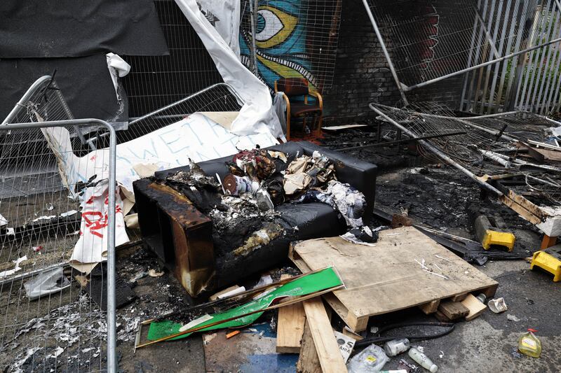 The burnt remains of an encampment used by asylum seekers at Sandwith Street, Dublin, May 2023. Photograph: Conor Ó Mearáin/Collins