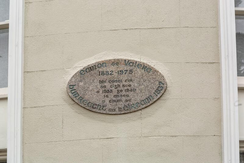 Plaque in Irish showing that Éamon de Valera lived and wrote the Irish Constitution here