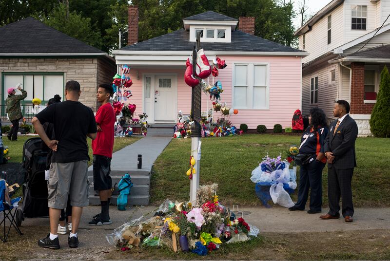 People outside Muhammad Ali's childhood home on Grand Avenue on June 10th, 2016, in Louisville, Kentucky awiting his funeral procession to pass. Photograph: Ty Wright/Getty Images