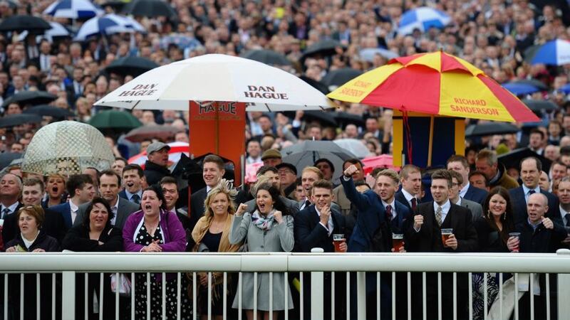 Punters cheer on their horses during the first race at Aintree. Photo: Laurence Griffiths/Getty Images