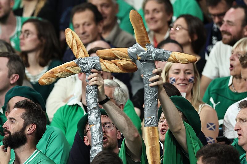 Irish supporters hold crosses made from baguettes during the game against Scotland at the Stade de France. Photograph: Franck Fife/AFP via Getty Images