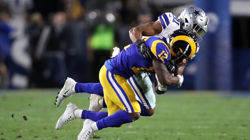Byron Jones tackles Brandin Cooks. Photo: Sean M. Haffey/Getty Images