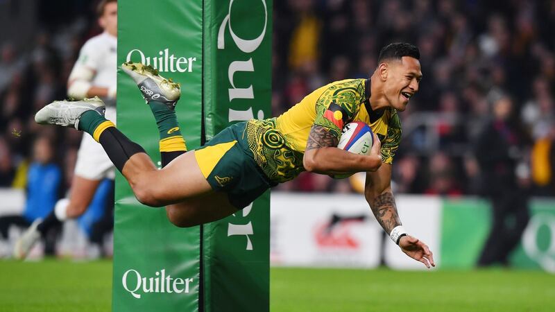 Israel Folau scores for Australia against England. He had his contract ended after making homophobic comments on social media. Photograph: Ben Stansall/AFP/Getty Images