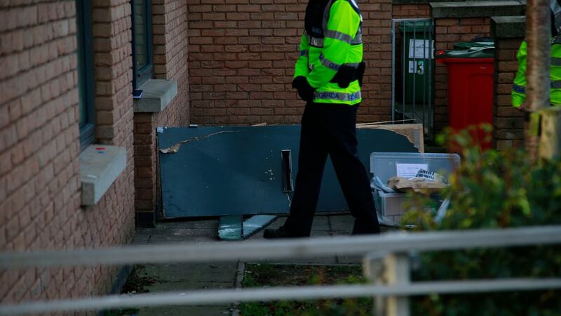 A damaged door is seen outside the house where a garda was shot and wounded in Ballymun this morning. Photograph: Nick Bradshaw/The Irish Times