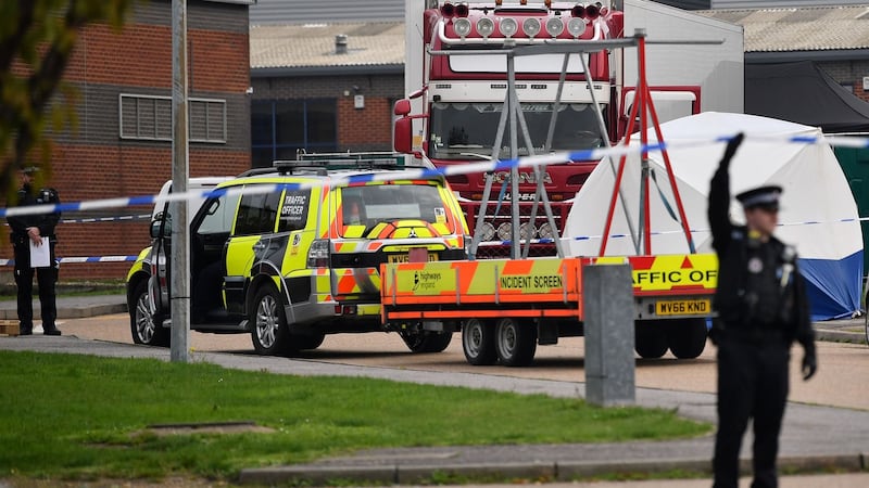 British Police officers work by the container in which the bodies of 39 migrants were found in Essex on Wednesday.  Photograph: Getty