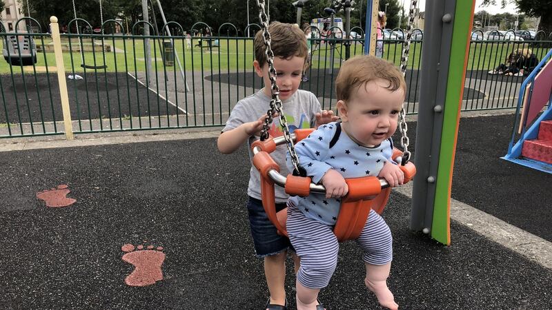 Arthur pushes Louis on the swing