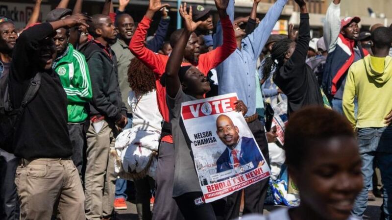 Protesters hold a poster of Movement for Democratic Change leader Nelson Chamisa during an anti-government protest in Harare in August 2019. Photograph: Zinyange Auntony/AFP/Getty Images