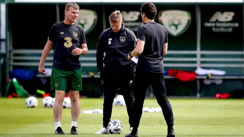 Republic of Ireland manager Stephen Kenny talks to his assistants Damien Duff and Keith Andrews. Photograph:  Ryan Byrne/Inpho