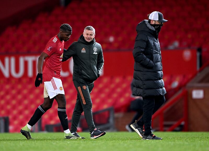 Paul Poga with Ole Gunnar Solskjaer after Manchester United’s FA Cup win over Liverpool. Photograph: Laurence Griffiths/PA