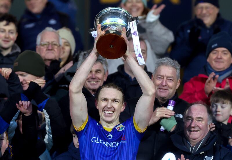 Longford's Patrick Fox lifts the O’Byrne Cup following the team's victory against Dublin in the 2024 final at O'Moore Park, Co Laois. Photograph: Lorraine O’Sullivan/Inpho