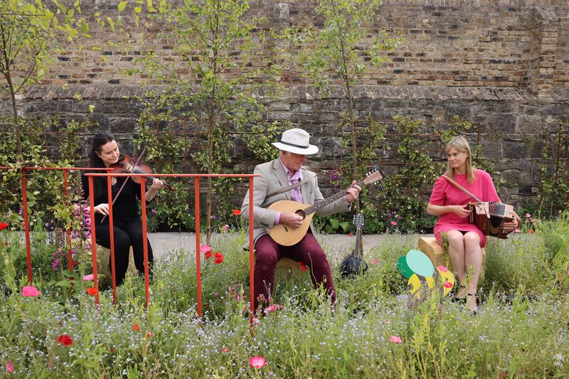 Joanne, Michael and Roz McVeigh in the Green Cities Parklet. Photograph: Dara Mac Dónaill/The Irish Times