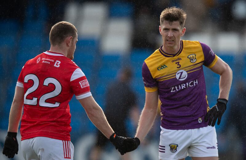 Louth's Niall Sharkey shakes hands with Gavin Sheehan of Wexford after their game in Portlaoise. Photograph: Leah Scholes/Inpho