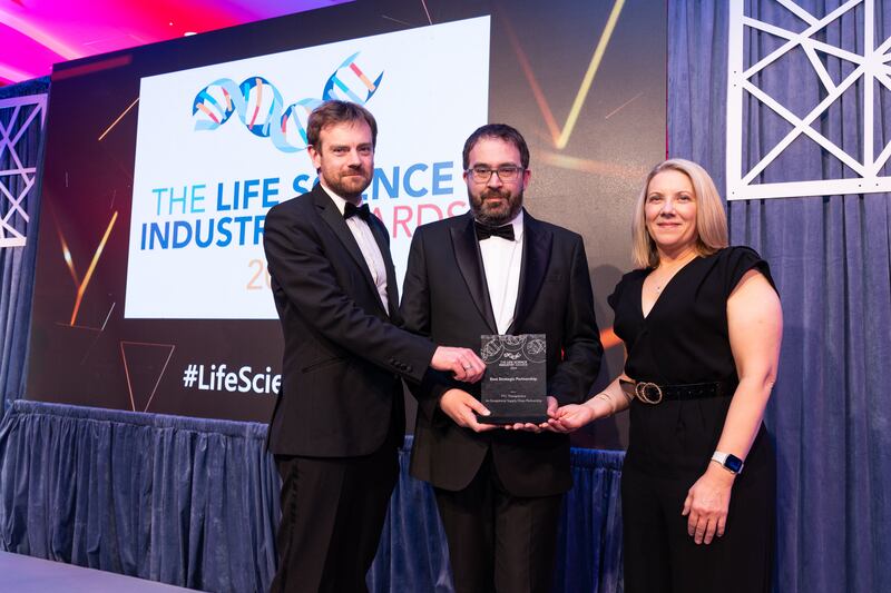 David Feighery, associate at Cundall, presents the best strategic partnership award to Austin Peavoy and Gabrielle White, PTC Therapeutics