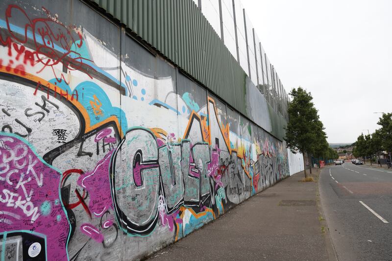 The Cupar Way side of the peace wall in west Belfast. Photograph: Bryan O’Brien 