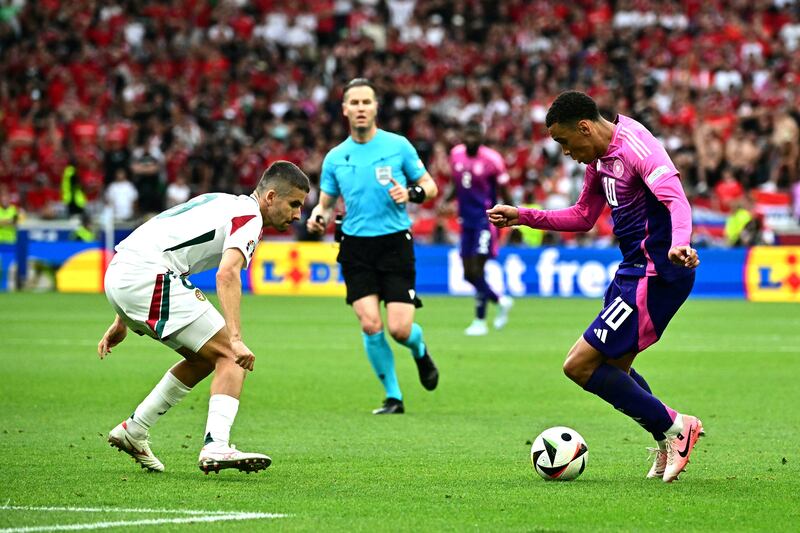 Hungary's midfielder Adam Nagy fights for the ball with Jamal Musiala. Photograph: Tobias Schwarz/AFP via Getty
