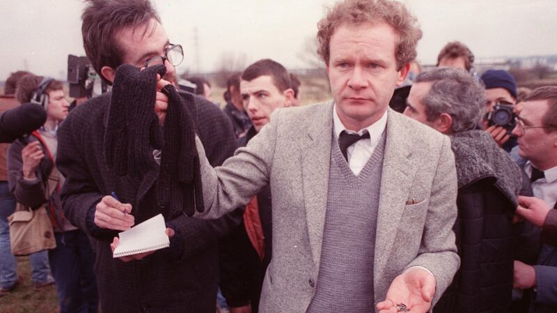 Martin McGuinness with Michael Stone’s gloves and bullets after the loyalist attacked the funerals of republicans Mairead Farrell, Sean Savage and Danny McCann in Millotwn cemetery. Photograph: Pacemaker