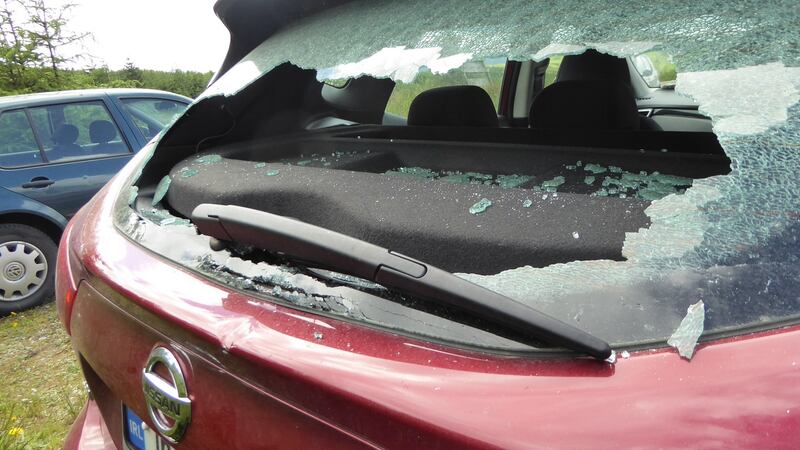 A car with its rear window smashed  Some of the cars that were broken into at th eShay Elliot car cark on Saturday. Photograph: Helen Lawless