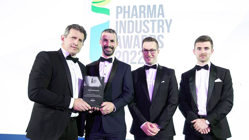 Enda Murphy, Managing Director, Ardmac Cleanrooms, presents the Health & Safety Award to the Pfizer Ireland Pharmaceuticals Ringaskiddy team.
