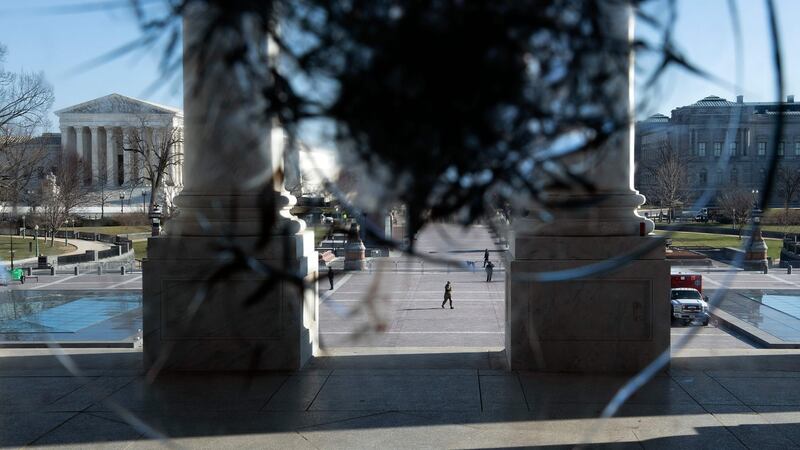 The US Supreme Court  is seen through a broken window a day after a pro-Trump mob broke into the US Capitol. Photograph: Brendan Smialowski/AFP
