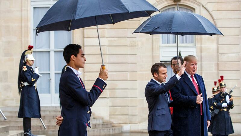Emmanuel Macron greets Donald Trump. Photograph: Christophe Petit Tesson/EPA
