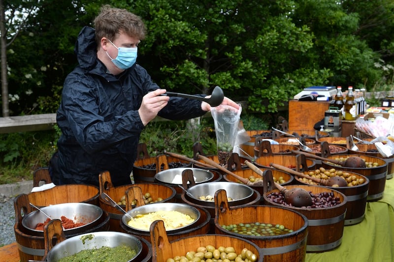 John Geraghty working on The Scarlet Olive stall as the farmers’ market reopened at Airfield Estate, Dundrum. Photograph: Dara Mac Dónaill/The Irish Times