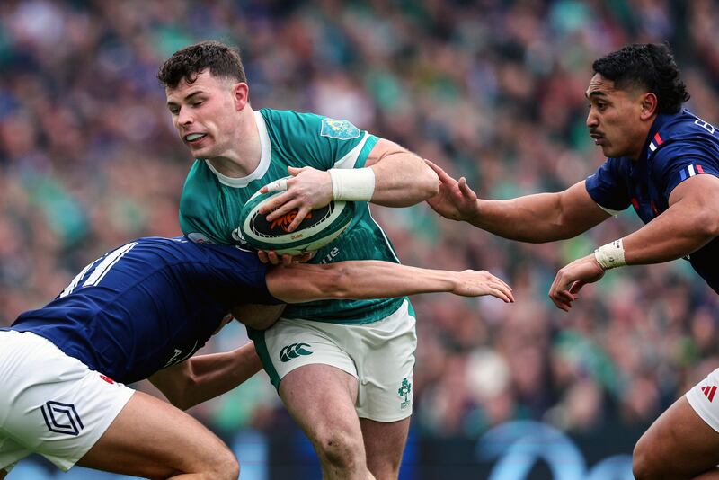 Calvin Nash is tackled by France's Louis Bielle-Biarrey. Photograph: Ben Brady/Inpho