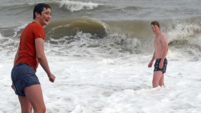 Edward Mansfield (left), of Longford, and Simon Duffy, of Sydney, Australia, braving the high sea and  winds  yesterday despite the cancellation of the New Year’s Day sea swim at Bray, Co Wicklow. Photograph: Eric Luke/The Irish Times