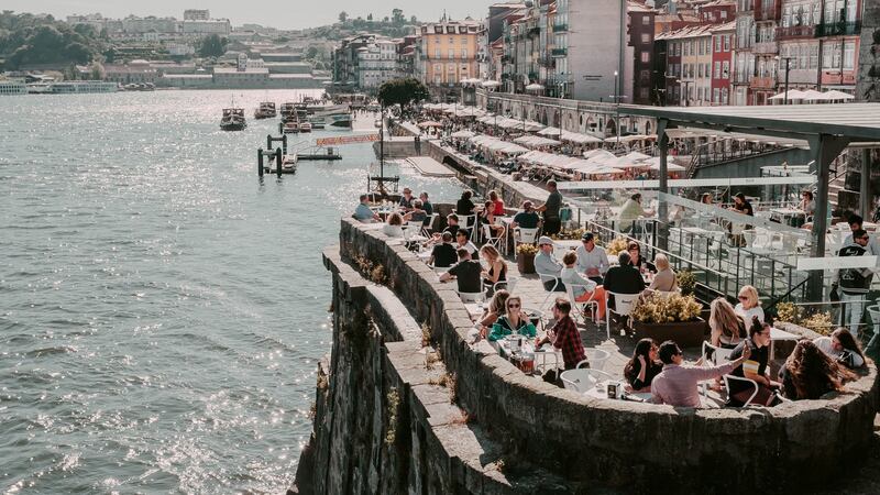 Old city houses over Douro river where tourists can enjoy lunch at a variety of outdoor restaurants. Photograph: Getty