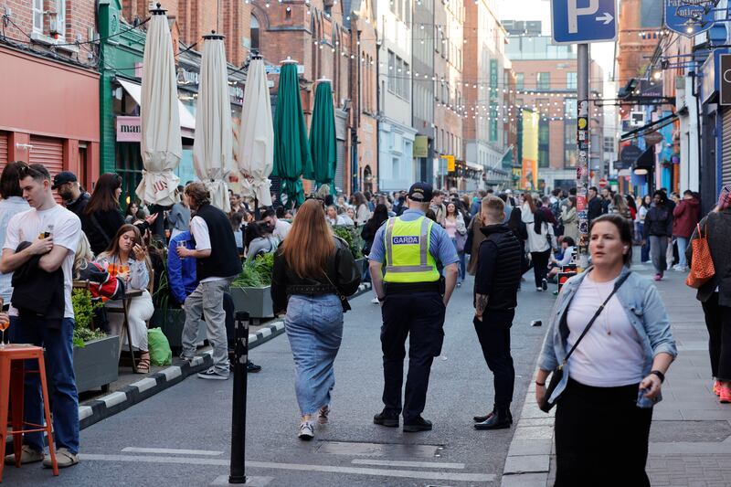 A garda on Drury Street on Friday, keeping  the main thoroughfare clear for passing  people. Photograph: Alan Betson


