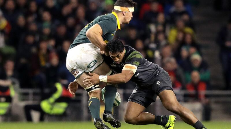 Bundee Aki tackles  Francois Louw of South Africa. Photograph: Morgan Treacy/Inpho