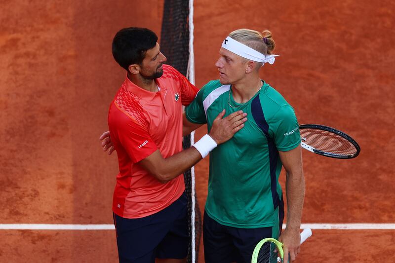 Novak Djokovic of Serbia shakes hands with Alejandro Davidovich Fokina of Spain at Roland Garros. Photograph: Clive Brunskill/Getty