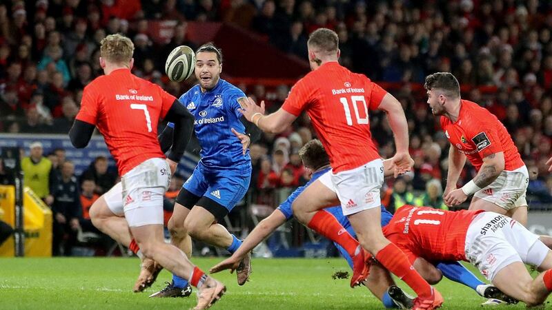 James Lowe receives an offload from Ross Byrne. Photo: Bryan Keane/Inpho