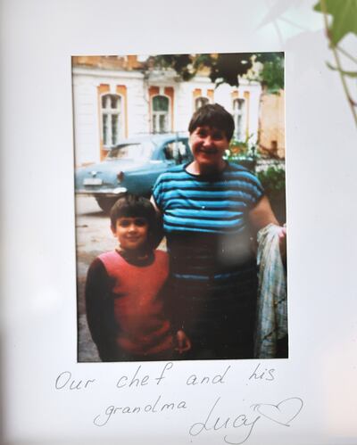 A photograph of Mykola Kuleshov with his grandmother Lucy that hangs on the wall at Lucy bakery. Photograph: Dara Mac Dónaill