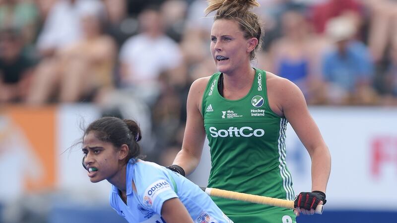 Ireland’s Nikki Evans in action against  India’s Nikki Pradhan. Photograph: Joe Toth/Inpho