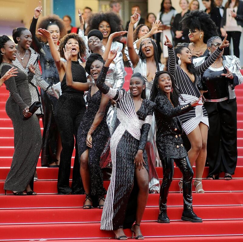 Black Is Not My Job: the book’s authors pose with jury member Khadja Nin. Photograph: Andreas Rentz/Getty