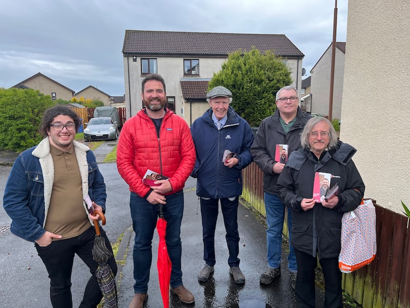 Gregor Poynton and his canvassing team in Livingston. Photograph: Mark Paul