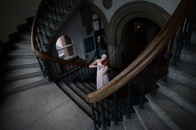 Charlotte Ryan (13) from Kildare rehearses before competing for the Terry O'Connor Trophy in the Strings section of the annual Feis Ceoil. Photograph: Bryan O’Brien/The Irish Times 
