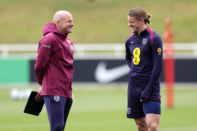 Lee Carsley and Conor Gallagher of England share a joke during an England squad  training session at St Georges Park in Burton-upon-Trent, England. Photograph: Carl Recine/Inpho 