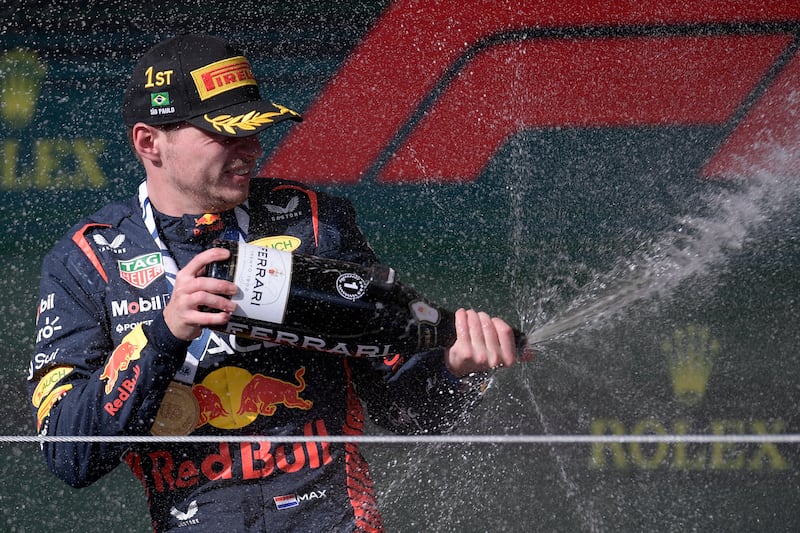 Red Bull Racing's Max Verstappen celebrates on the podium after winning the Brazil Grand Prix at the Autodromo Jose Carlos Pace racetrack in Sao Paulo. Photograph: Douglas Magno/AFP/Getty Images