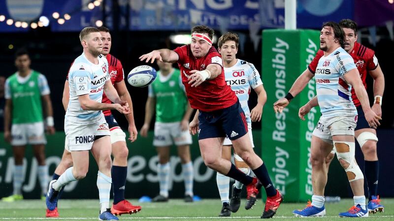 Niall Scannell tries to charge down Finn Russell during Racing 92’s win over Munster. Photograph: Dan Sheridan/Inpho