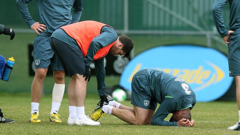 Walters in pain after a collision with Shane Long at Gannon Park. Photograph: Donall Farmer/Inpho
