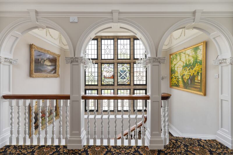 Stained-glass window with Jameson crest